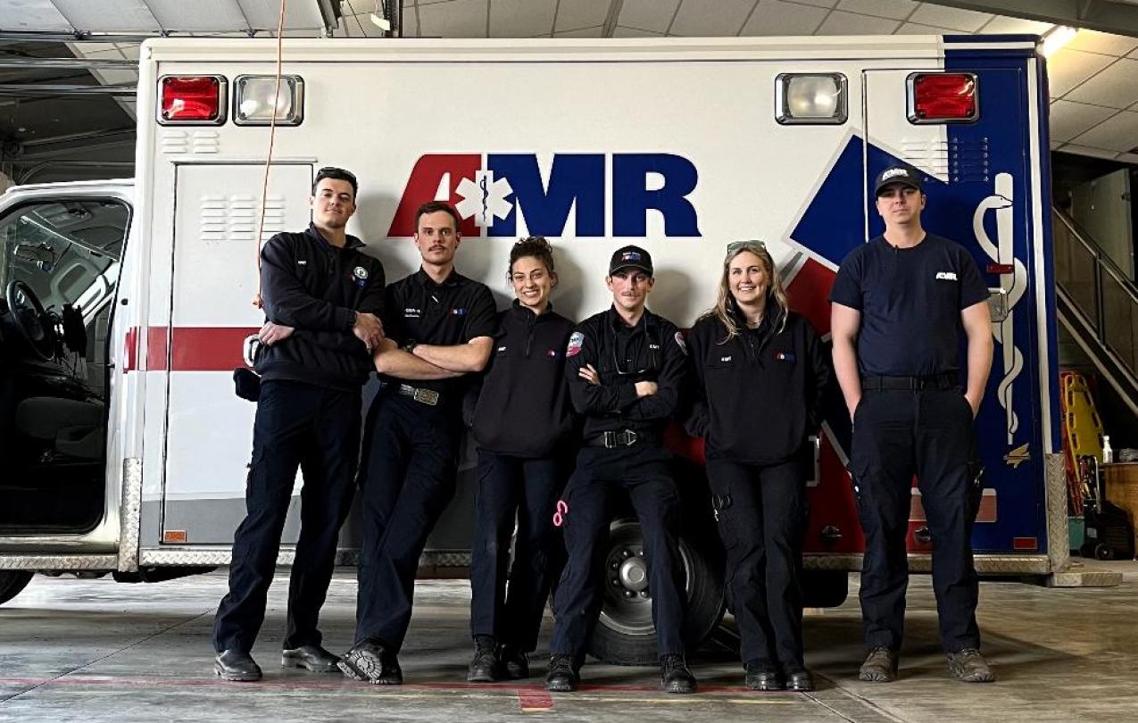 Tyler Holmes (left) with his colleagues at AMR Bozeman. Photo courtesy of Tyler Holmes.